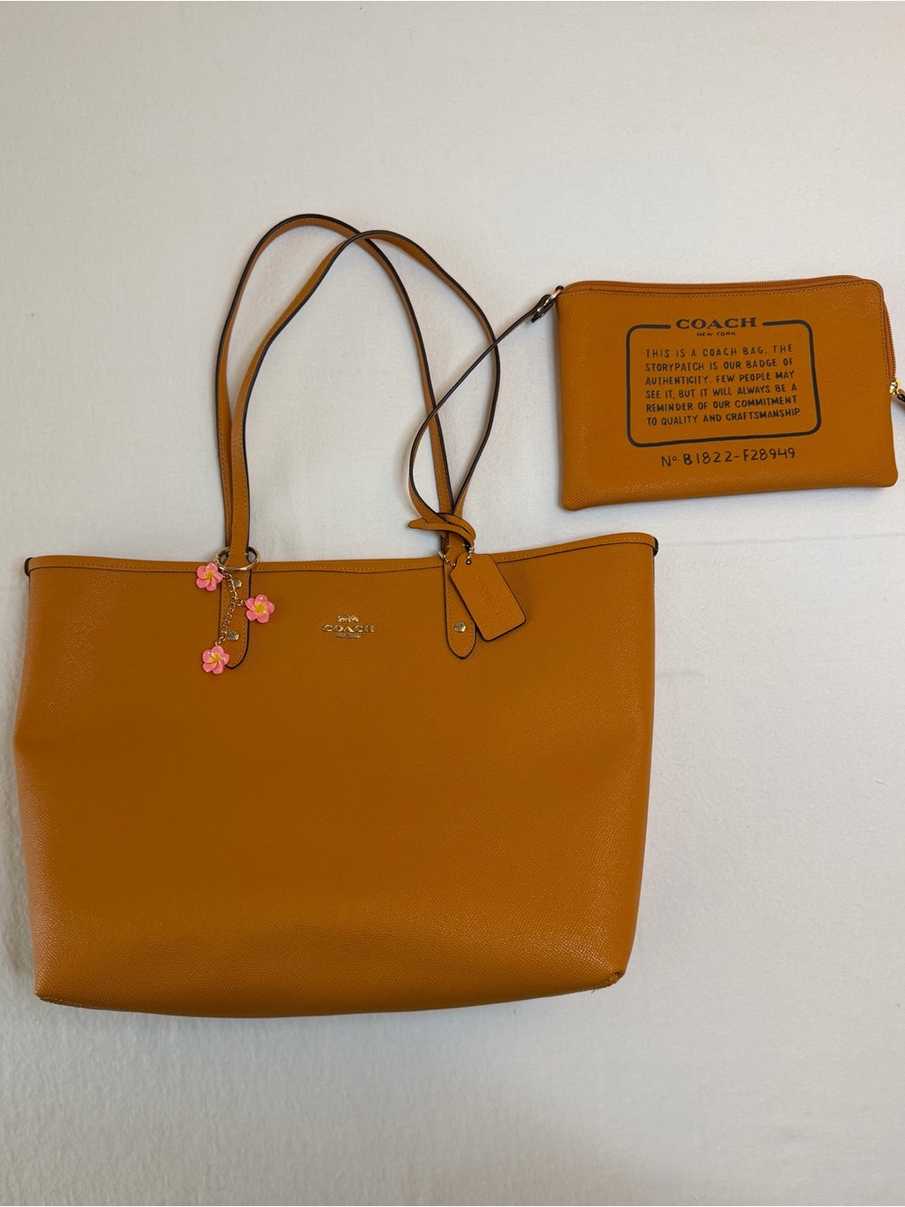 Coach reversible city tote with Hawaiian print and matching clutch